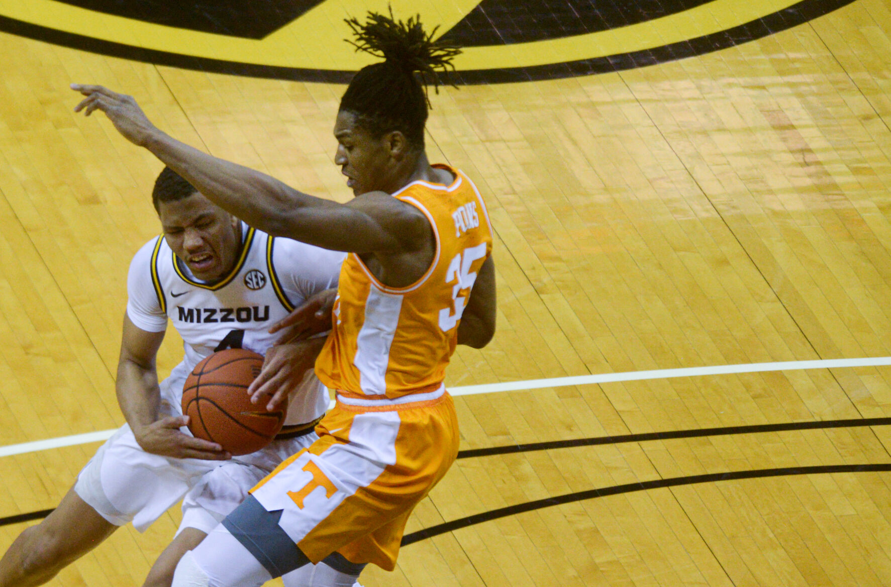 Missouri guard Javon Pickett tries to get past Tennessee guard Yves Pons